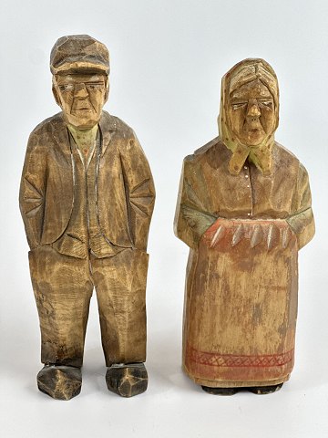 Pair of handmade, Danish wooden figures of a woman with a scarf and a man with a 
cap, circa 1950s.