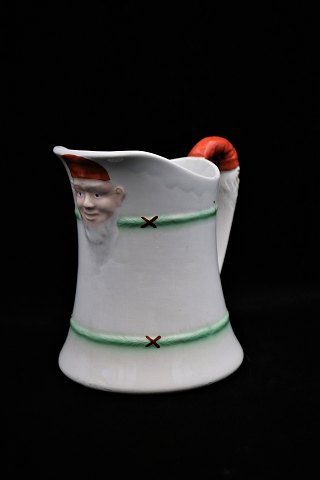 Antique earthenware Christmas jug from Rörstrand with elves on the handle and on 
the front...
