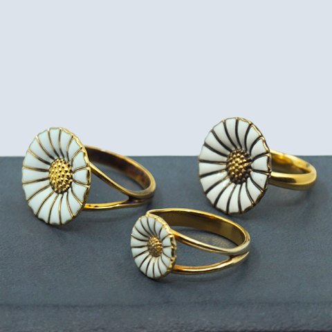 Georg Jensen; Daisy rings of gilted sterling silver with enamel