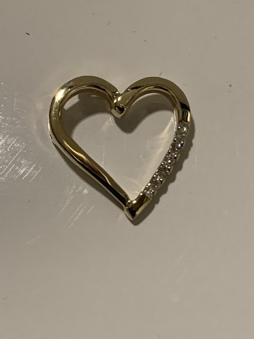 Pendant 14 carat gold, designed as a Heart
with embedded diamonds.