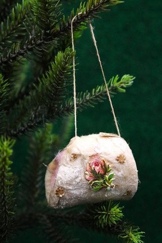 Antique Christmas tree decoration in the form of a small bag made of cotton wool 
and glossy image from around 1900...