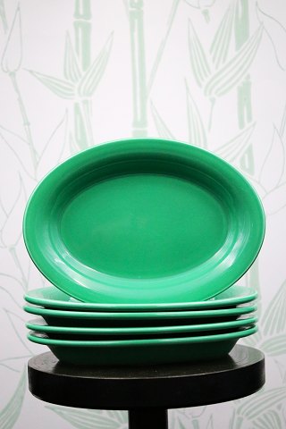 Ursula green earthenware saucer / dish from Royal Copenhagen.
18x13cm.
RC# 073...