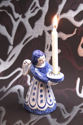 L. Hjorth ceramic large angel with blue / white glaze holding a small candle. 
H:14cm...