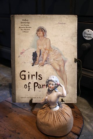 Decorative French Art Deco book cover from the 20s with a motif of a lightly 
dressed woman...