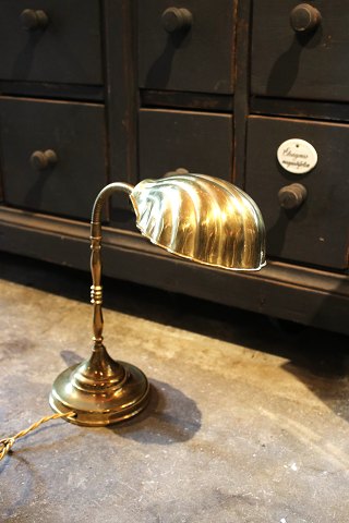 Old table lamp in brass with clam shaped lampshade...