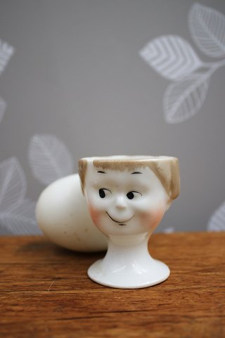 Old egg cups from the 30s in porcelain with painted funny faces...