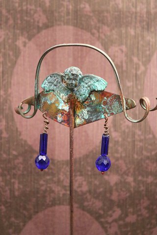 Unique old flower stick in patinated copper with small angel and glass beads made by jewelry artist Torben Hardenberg.