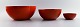 KAJ FRANCK, Finnish designer.
3 red bowls in enameled metal, Finel, Finland, 1950s.