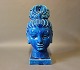 Oriental ceramic head of a woman with a dark blue glaze.
5000m2 showroom.