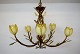 Possoni Italy. Chandelier with frame of bronze-colored metal decorated with 
foliage.