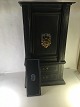 Stentoft Antik presents: Old unique safe in miniature. standing on wooden shelf. with 2 drawers.gate with ...