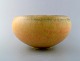 Saxbo. Stoneware bowl in modern design, glaze in yellow shades.