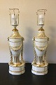 Danam Antik presents: Royal Copenhagen A pair of baluster-shaped lamps on base decorated with garlands, Ram ...