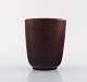 Nils Thorsson for Aluminia. "Marselis" faience vase with geometric pattern in 
beautiful ox blood glaze.