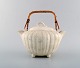 Gunnar Nylund for Rørstrand. Double jug in glazed ceramics. Cream colored 
eggshell glaze and handles in wicker. 1960
