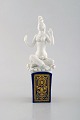 Peter Strang (b.1936) for Meissen. Blanc de chine "Scheherezade" figure on blue 
pedestal with gold decoration. 1980 / 90