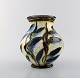 Kähler, HAK, glazed stoneware vase in modern design. 1930 / 40s. Blue flowers on 
cream colored background.

