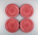 Jens H. Quistgaard for Bing & Grondahl. Four rare "Cordial Palet" dinner plates 
in glazed stoneware. 1960. Pink.