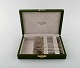 Bernard Yot for Christofle. Twelve "Aria" dessert spoons in plated silver with 
gold accent. In original box.
