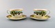 Gianni Versace for Rosenthal. Two "Ivy Leaves Passion" cups with saucers. Late 
20th century.
