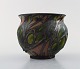 Kähler, HAK, glazed stoneware vase in modern design. 1930 / 40s. Leaves and 
branches on brown background.
