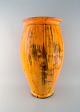 Svend Hammershøi for Kähler, Denmark. Colossal vase in glazed stoneware. 
Beautiful yellow uranium glaze. 1930 / 40