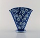 Kähler, Denmark. Glazed stoneware vase in modern design. White flowers on blue 
background. 1930 / 40