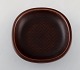 Nils Thorsson for Aluminia. "Marselis" faience bowl with geometric pattern in 
beautiful ox blood glaze. Mid 20th century.
