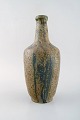Patrick Nordstrøm for Royal Copenhagen. Large vase in glazed stoneware. 
Beautiful glaze in blue green tones. 1940