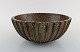 Arne Bang. Large bowl with fluted corpus decorated with brown speckled glaze. 
1930/40