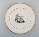 Royal Copenhagen dinner plate in hand-painted porcelain with bird motifs and 
gold decoration. Early 20th century. 31 pcs in stock.
