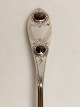 Silver spoon with two red fluffs dated 1828