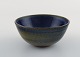 Wallåkra, Sweden. Bowl in glazed ceramics. Beautiful glaze in blue and light 
earth shades. 1960s.
