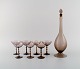 Simon Gate for Orrefors. Art deco liqueur set in smoky mouth-blown art glass. 
Seven glasses and carafe. 1930