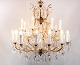 Large antique French chandelier of brass from around the 1920s.
5000m2 showroom.
