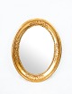 Ovale mirror decorated with gilded frame from around the year 1880.
5000m2 showroom.