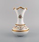 Limoges vase in hand-painted porcelain with floral and gold decoration. 1920