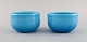 Michael Bang for Holmegaard. Two Palet bowls in light blue mouth blown art 
glass. Mid-20th century.
