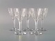 Baccarat, France. Five white wine glasses in clear mouth-blown crystal glass. 
Mid-20th century.
