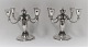 Lundin Antique presents: K. C. Hermann. A pair of 4-armed silver candlesticks. Height 21 cm. Good quality. ...