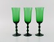 Simon Gate for Orrefors. Three Salut champagne glasses in green mouth blown art 
glass. Swedish design, 1920s / 30s.
