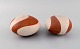 European studio ceramicist. Two rattle instruments in glazed stoneware. 
Hand-painted wavy decoration in orange-brown shades. Late 20th century.
