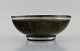 Wilhelm Kåge (1889-1960) for Gustavsberg. Argenta art deco bowl in glazed 
ceramics. Beautiful glaze in shades of dark green with silver inlay. Dated 1937.
