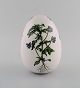 Porcelain egg. Hand-painted flowers, gold and pink decoration. Flora Danica 
style. Dated 2001.
