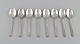 L'Art presents: Eight Georg Jensen Pyramid dessert spoons in sterling silver.