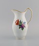 Royal Copenhagen Saxon Flower jug in hand-painted porcelain with flowers and 
gold decoration. Model number 493/1609. Early 20th century.
