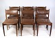 Et sæt af 6 stole af dansk design lavet i massiv palisander med brunt læder fra 
omkring år 1960