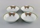 Limoges, France. Four rare Christian Dior "Spring" bowls in porcelain decorated 
with ribbon and bow. 1980s.
