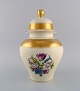 Large Rosenthal lidded vase in cream-colored porcelain with hand-painted flowers 
and gold leaf decoration. Mid-20th century.
