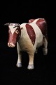 Decorative, old painted wooden cow with a nice patina...
H:14cm. L:26cm.